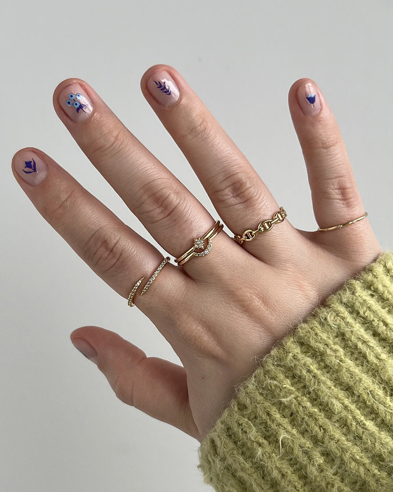 This bold claw ring is dipped in 14k gold and features stunning gemstones that hug your finger while adding a touch of confidence to your ring stack.