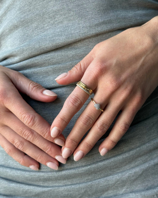 Beautifully crafted in recycled Sterling Silver and dipped in 14K gold, this eternity ring is a fresh take on a classic and timeless piece.