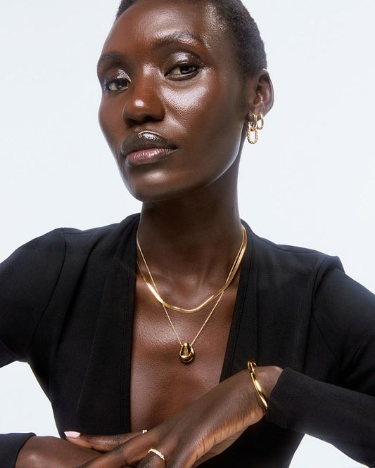 This gold pendant necklace is the elegant addition your look needs. Dipped in 14k gold, this pendant necklace will ground your look and elevate your every day.
