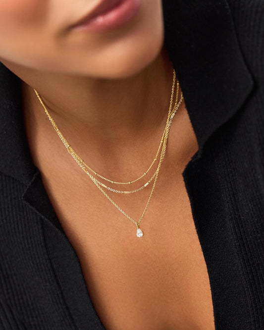 Create your own elegant and feminine look with this gold ball chain necklace and match it with your favorite pair of gold dangle earrings.